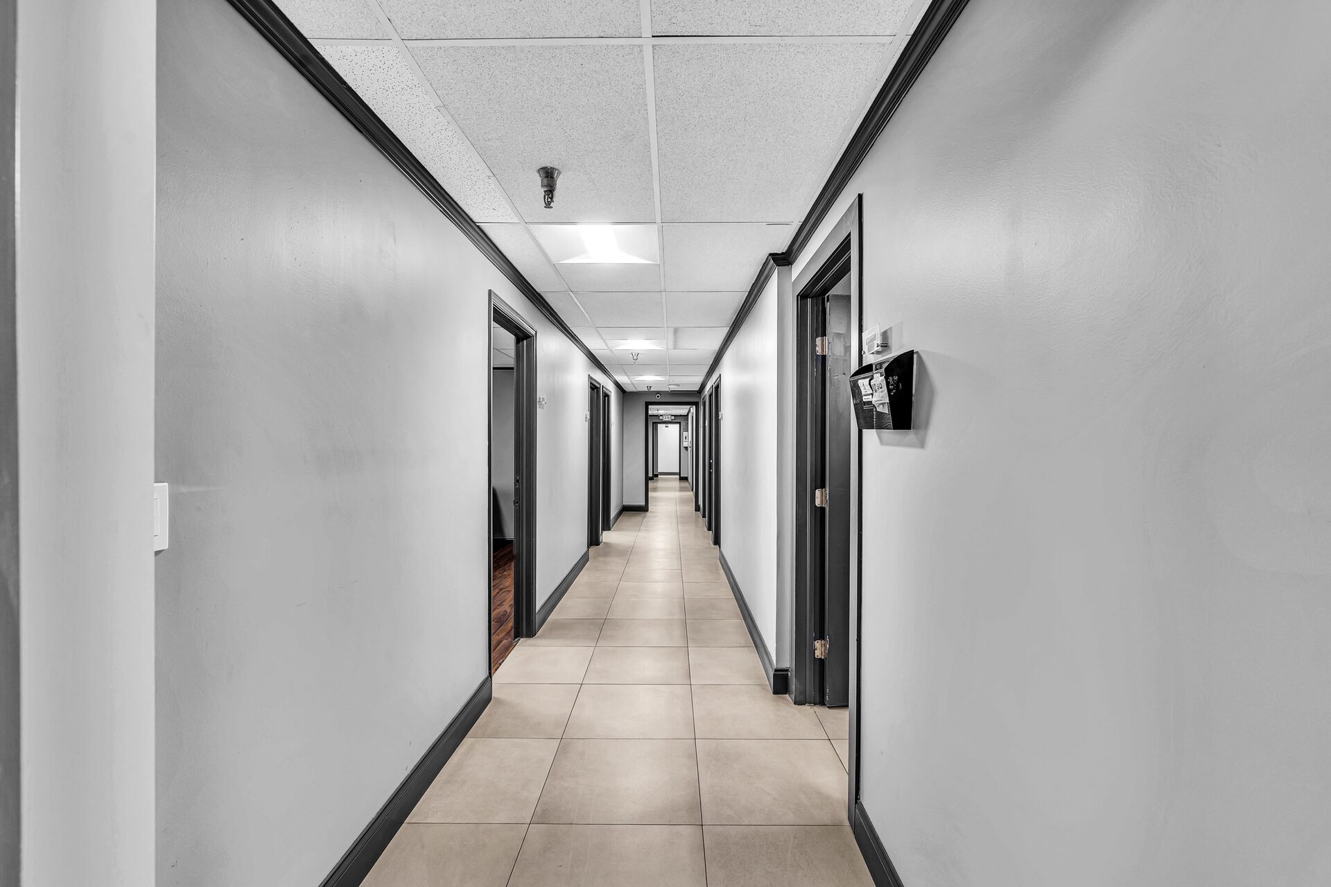 Bright suite corridor between executive offices, renovated 2025