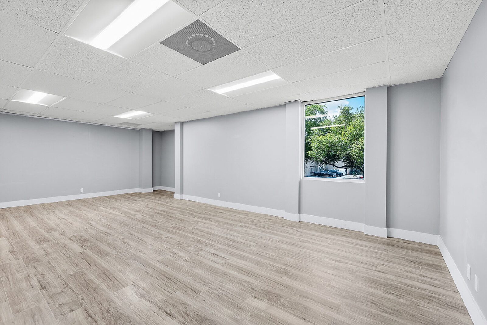 Office suite with bright window views at Pompano Executive Rentals